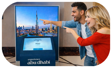 Multi-screen interactive UAE landmark guessing game display with custom branded interface for immersive event activation and digital tourism engagement.